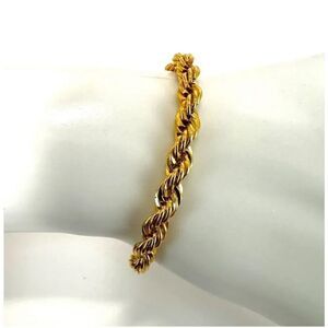 Gold tone braided bracelet